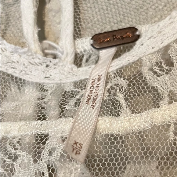 Free People off-white short sleeve crop with lacy bodice and raw hem. - Picture 6 of 7